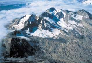 Aerial view of four mountain peaks in the clouds Aerial view of four mountain peaks in the clouds