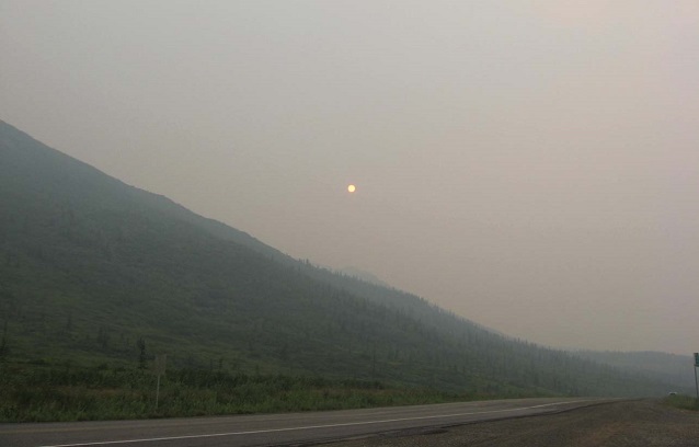 The sun seen through hazy smoke-filled skies
