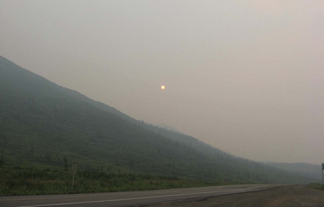 The sun seen through hazy smoke-filled skies The sun seen through hazy smoke-filled skies