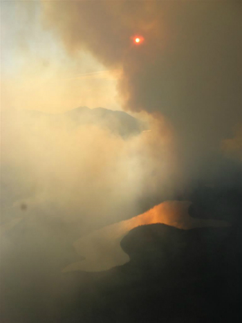 clouds of smoke block out the sun