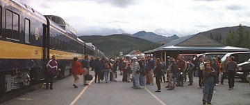 visitors board a train
