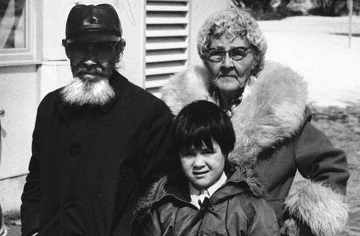 historic photograph of a man, woman, and young boy