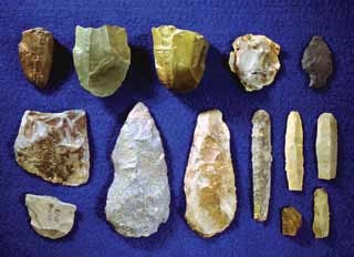 stone tool artifacts displayed on a blue background stone tool artifacts displayed on a blue background