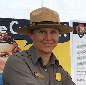 Image of Dael Devenport in uniform standing in front of display