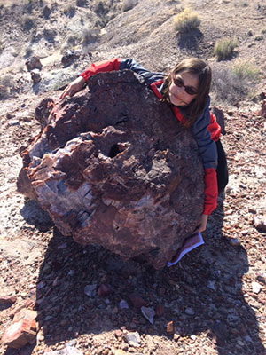 Talia hugs petrified stump at Petrified Forest National Park Talia hugs petrified stump at Petrified Forest National Park