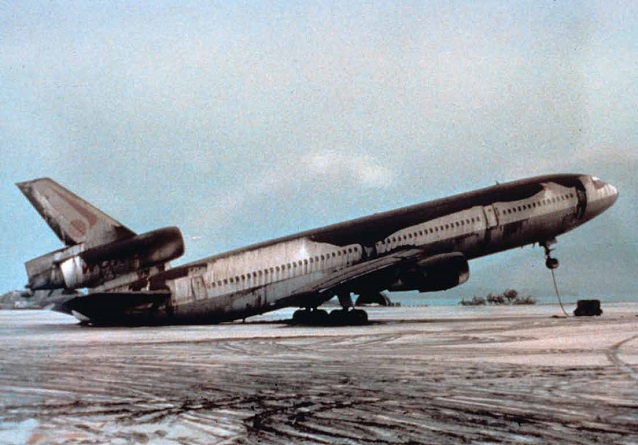 large airplane is off-balance from the weight of an eruption's ash