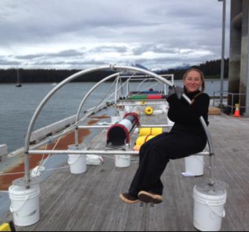 person with hydrophone on a dock