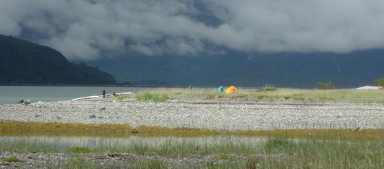 two distant tents on a beach