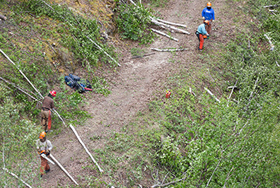 Workers on a dirt road Workers on a dirt road