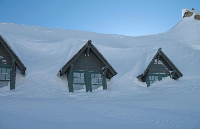 upper windows completely covered by snow in the winter.