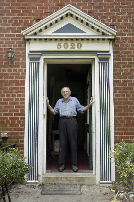Dr. Franklin E. Kameny standing with his hands on both sides of his door frame Dr. Franklin E. Kameny standing with his hands on both sides of his door frame