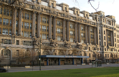 The outside of the Cook County Hospital, a multi-story stone building