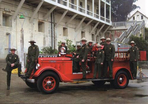 fully restored Diamond T with park employees in uniform