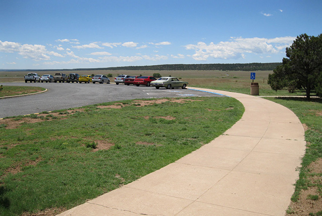 Curved walkway and parking lot of visitor center (Mission 66 Visitor Center Site: CLI, NPS, 2010)