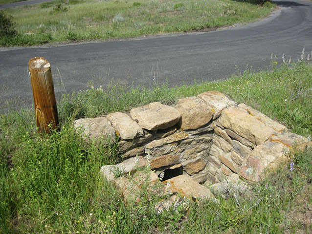 Stone drainage structure along entrance, 2010 (C. Mardorf, NPS)