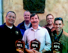 Fire Employees with plaques and awards for leadership