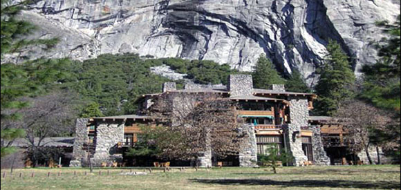 Exterior building with mountain face in the background.