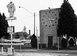 Historic neon Chevron sign and the memorial clock tower