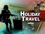 traffic with holiday travel text over the image