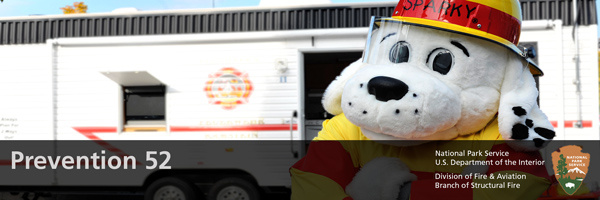 white sparky dog with a red fire hat white sparky dog with a red fire hat