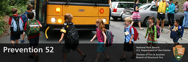 school children getting onto a bus