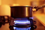 saucepan on a working gas stove burner saucepan on a working gas stove burner