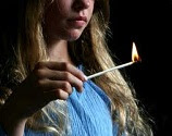 teenager girl with a long lit match