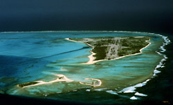 Aerial view of Midway Atoll, Spit Island is in the foreground with Eastern Island in the distance