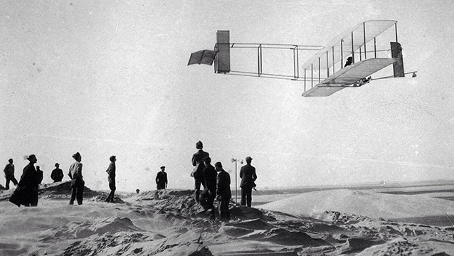 historic black and white image of a crowd watching one of the first gliders in 1911 historic black and white image of a crowd watching one of the first gliders in 1911