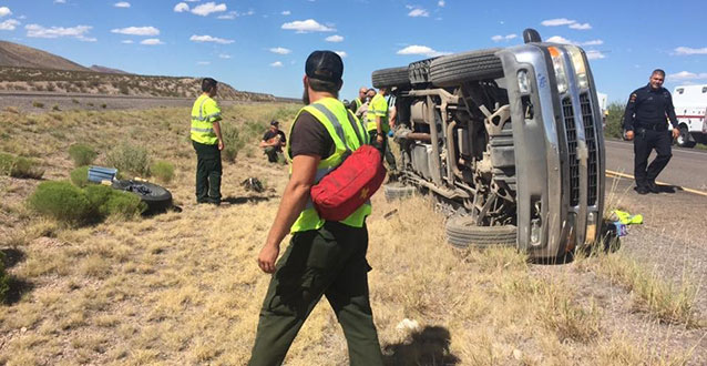 Firefighters providing assistance on the scene of a car accident. Firefighters providing assistance on the scene of a car accident.