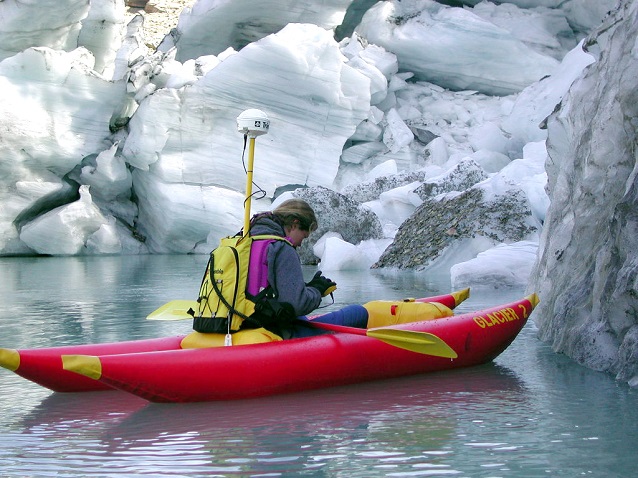 A scientist among the icebergs at the terminus of Grinnell Glacier (Glacier National Park, Montana) A scientist among the icebergs at the terminus of Grinnell Glacier (Glacier National Park, Montana)
