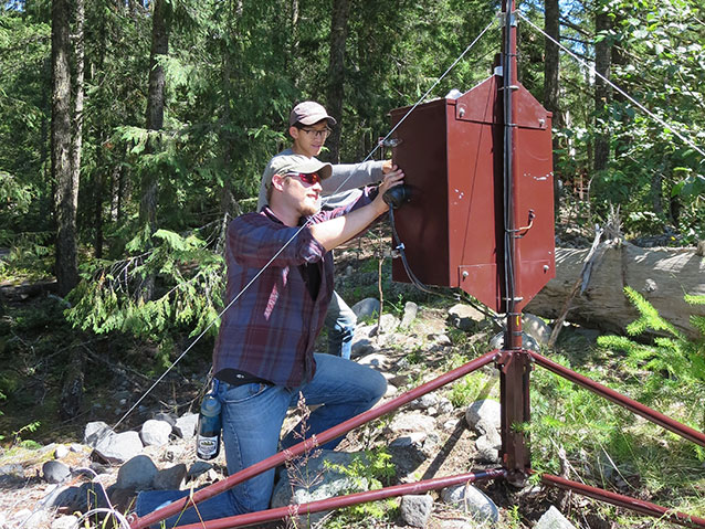 Interns working on field equipment