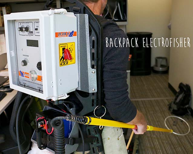 a metal box backpack connected to a metal wand a metal box backpack connected to a metal wand