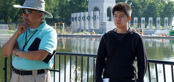 young volunteer intern at the National Mall park with his mentor. young volunteer intern at the National Mall park with his mentor.