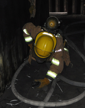 a student successfully navigates through a tangled hoseline in the dark