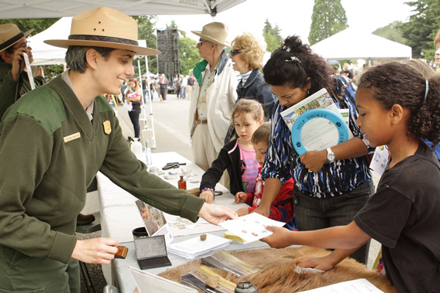 Curator Theresa Langford talks to park visitors