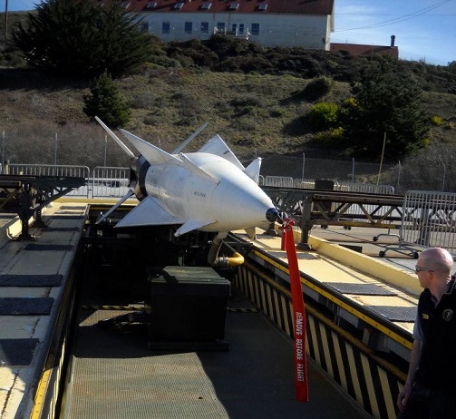 NPS employee Charles Notzon with a missile NPS employee Charles Notzon with a missile