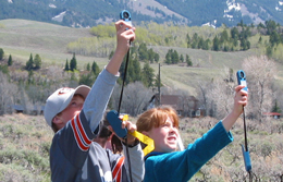 Kids testing the air quality in the national park. 