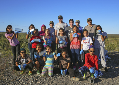 a group of campers with park rangers