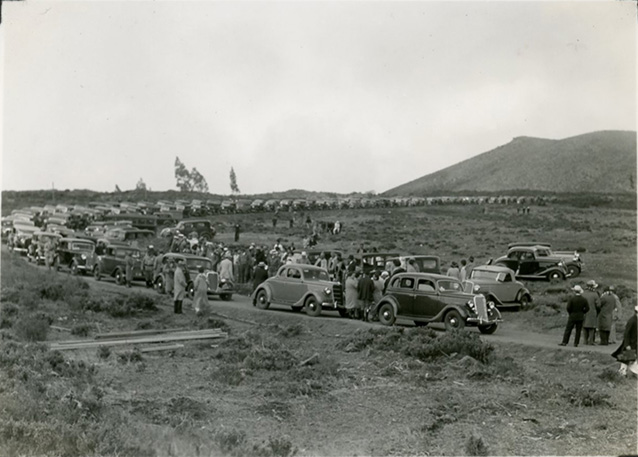 Cars parked in a long line along the Haleakala Highway during the opening ceremony in 1935.