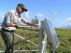 Park ranger working on weather data collection equipment