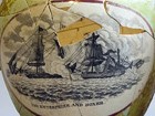 Fragmented pots showing naval battle scenes