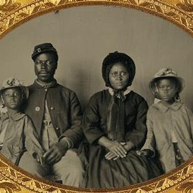Photo of African American soldier in Union uniform with his family Photo of African American soldier in Union uniform with his family
