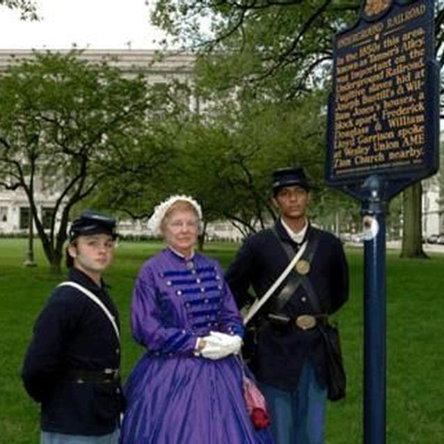 Photo of living history interpreters in Civil War period dress. Photo of living history interpreters in Civil War period dress.