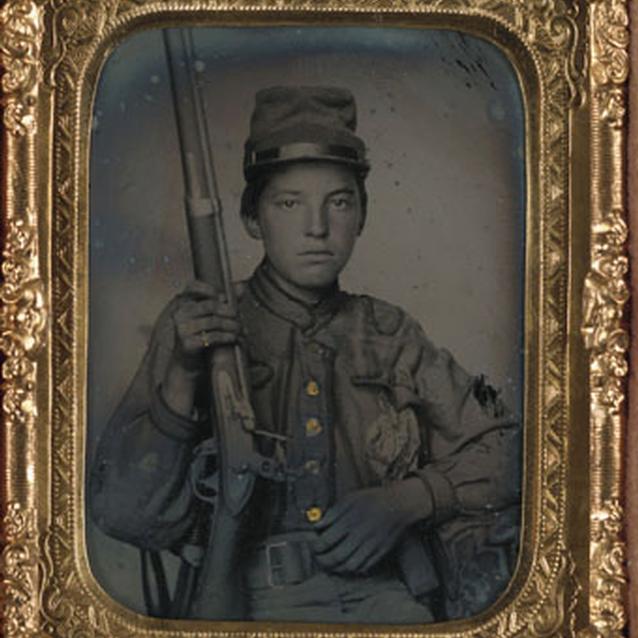 Photograph of a young boy soldier Photograph of a young boy soldier