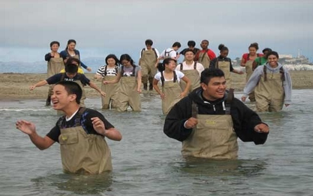 Galileo High School students wade in the water near Crissy Field as part of an AP Environmental Science course.