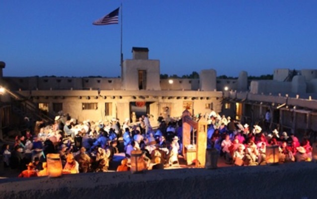 Many people in the plaza of Bent's Old Fort National Historic Site