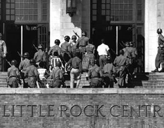 Photo of National Guard escorting African American student into Little Rock Central High School