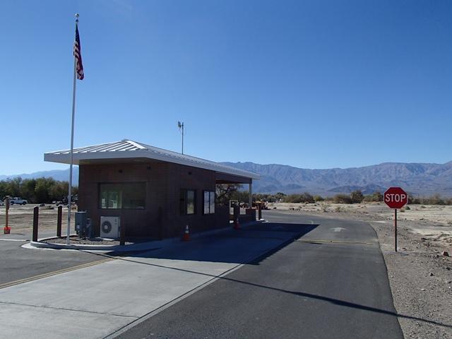 a small building with a flagpole