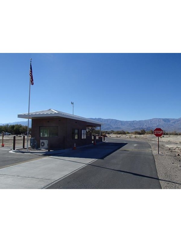 a small building with a flagpole